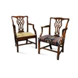 Two similar George III mahogany elbow dining chairs, in the manner of Chippendale (2) 95 x 65cm (