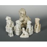 A group of six Chinese Dehua Fo-Dog jostick holders, Qing Dynasty, each seated with paw raised on