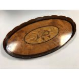 An Edwardian satinwood and marquetry inlaid oval tray, with scalloped gallery, the centre with