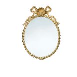 A late 18th century giltwood framed oval mirror, carved with laurel leaves united by a shell and