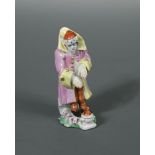 A Longton Hall figure emblematic of winter, circa 1755, modelled as an elderly gentleman wearing a