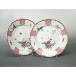 A pair of Tournai plates, circa 1780, painted to the centres with scattered floral sprays, within
