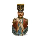 A highly decorative life-size half carved wood polychrome painted bust of a Napoleonic officer, with