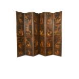 A late 18th century Dutch painted leather four fold screen, decorated with lovers, sheep, fowl and