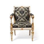 A Regency white painted and parcel gilt open arm chair in the style of George Smith, with lion