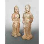 A pair of large Northern Wei dynasty bearded and armoured warriors, with traces of several