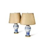 A pair of 20th century Japanese blue and white baluster vases fitted as table lamps, with fixed ring
