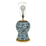 An 18th century Dutch Delft blue & white vase, now fitted as a table lamp, painted with an all