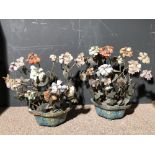 A pair of Chinese cloisonne and hardstone jardinieres of flowers, the vases of quatrefoil form,