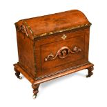 A Victorian walnut domed top cellarette, with applied carved decoration, on scroll carved legs 51