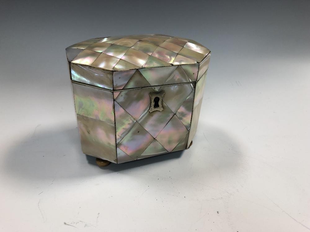 A 19th century mother-of-pearl tea caddy, of heavily canted rectangular form, with internal lift-out