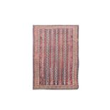 A Gendje red ground rug, with multiple white and blue central stripes 268 x 158cm (105 x 62in)