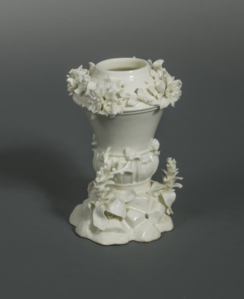 A Saint-Cloud blanc de chine pastille burner, circa 1730-50, the tapering body with a lower band