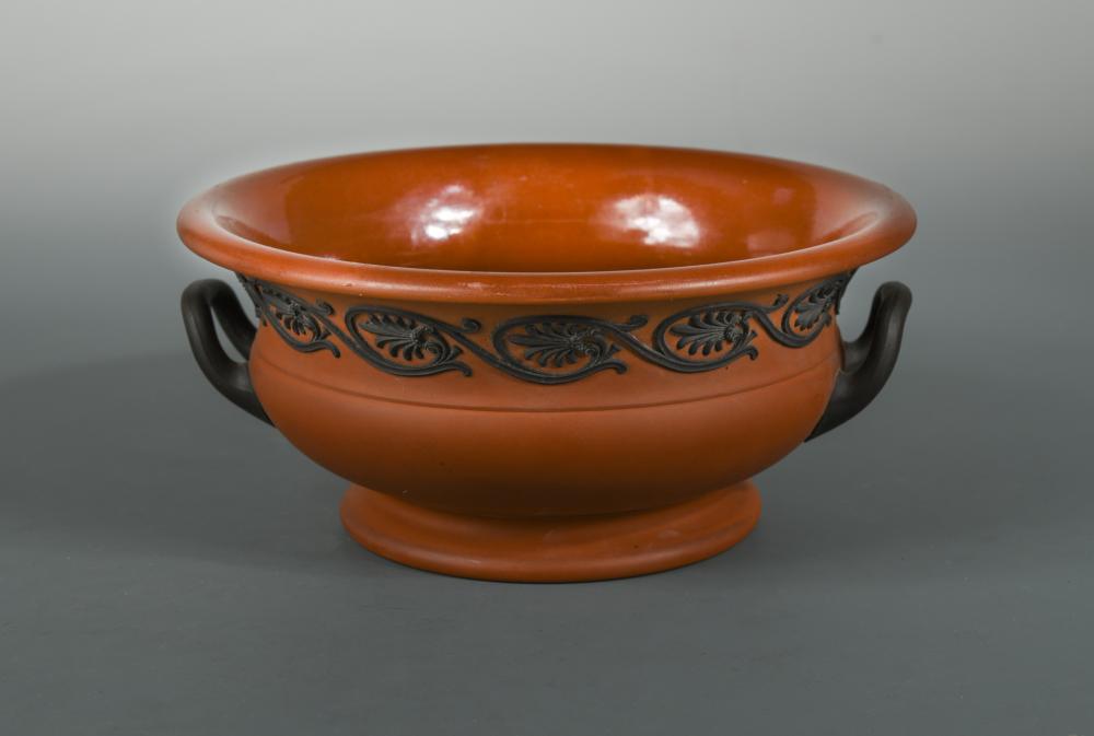 A 19th century Wedgwood Rosso Antico two-handled pedestal bowl, sprigged with a border of palmettes,