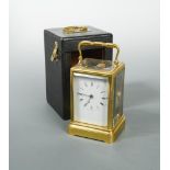 A French 19th century gilt brass carriage clock, with white enamel dial and Roman numerals, bell