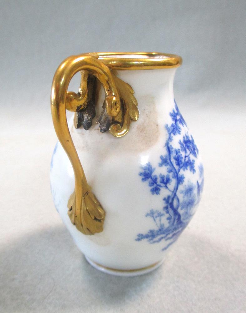 A Sevres ormolu mounted cream jug, painted by Francois Jospeh Aloncle in camaieu bleu with vignettes - Image 4 of 5