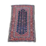 A Caucasian dagestan blue ground rug, 242 x 137cm (94 x 53in)