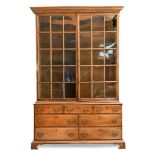 A George II walnut and parcel gilt large bookcase, the upper part with two glazed panelled doors