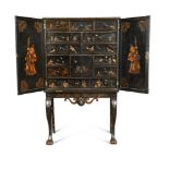 A late 19th century lacquer cabinet on stand, fitted with twelve drawers and a small cupboard,
