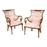 A pair of mid-19th century French carved mahogany armchairs, upholstered in 'la toile de jouy'