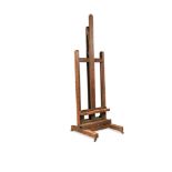 A large late 19th century oak artist's adjustable easel, 221 x 67 x 78cm (86 x 26 x 30in)