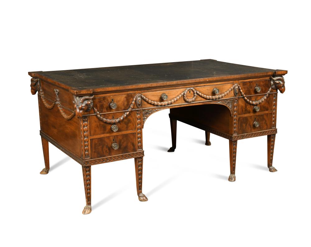 A late 19th century Adam revival mahogany partners desk, the eared top inset with a green leather