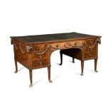 A late 19th century Adam revival mahogany partners desk, the eared top inset with a green leather