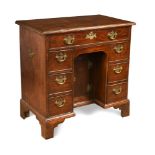 A mid-18th century mahogany kneehole desk, with brass side carrying handles 75 x 116 x 46cm (29 x 45