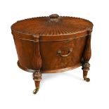 A George III mahogany oval wine cooler, in the manner of Gillows of Lancaster, the top carved with