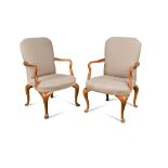 A pair of early 20th century George I style walnut framed upholstered armchairs, with shepherd crook