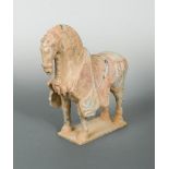 A pottery model horse, Sui or early Tang Dynasty, the head slightly lowered, on a rectangular base