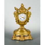A French late 19th century neo classical ormolu mantel clock, the urn shape case with bud finial