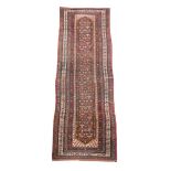 An early 20th century Shiraz runner, the centre woven with stylised ornament on a black ground