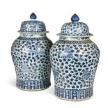 A pair of Chinese blue and white large vases and covers, Qing, 19th century, painted with