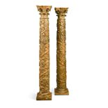 A pair of 18th century Italian carved giltwood column alter candlestick bases, each carved in relief