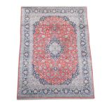 A Tabriz madder ground carpet 440 x 290cm (172 x 113in)