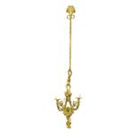 A set of four Louis XVI style ormolu three branch wall-lights, in the manner of Gouthiere, each