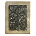 A Medieval style cast metal plaque, cast with figures of St Paul and St Peter, traceried arch above,