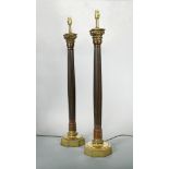 A pair of modern mahogany and brass mounted table lamps, each with brass Corinthian capital to