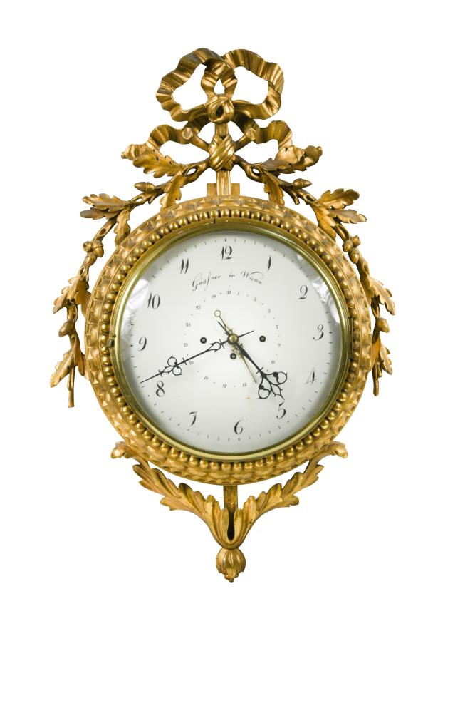 An early 19th century Austrian giltwood wall clock, signed 'Gassner in Wien', the 25cm white dial