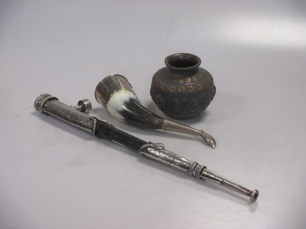 A middle Eastern silvered and brass vase, a white metal mounted horn and a pipe