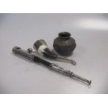 A middle Eastern silvered and brass vase, a white metal mounted horn and a pipe