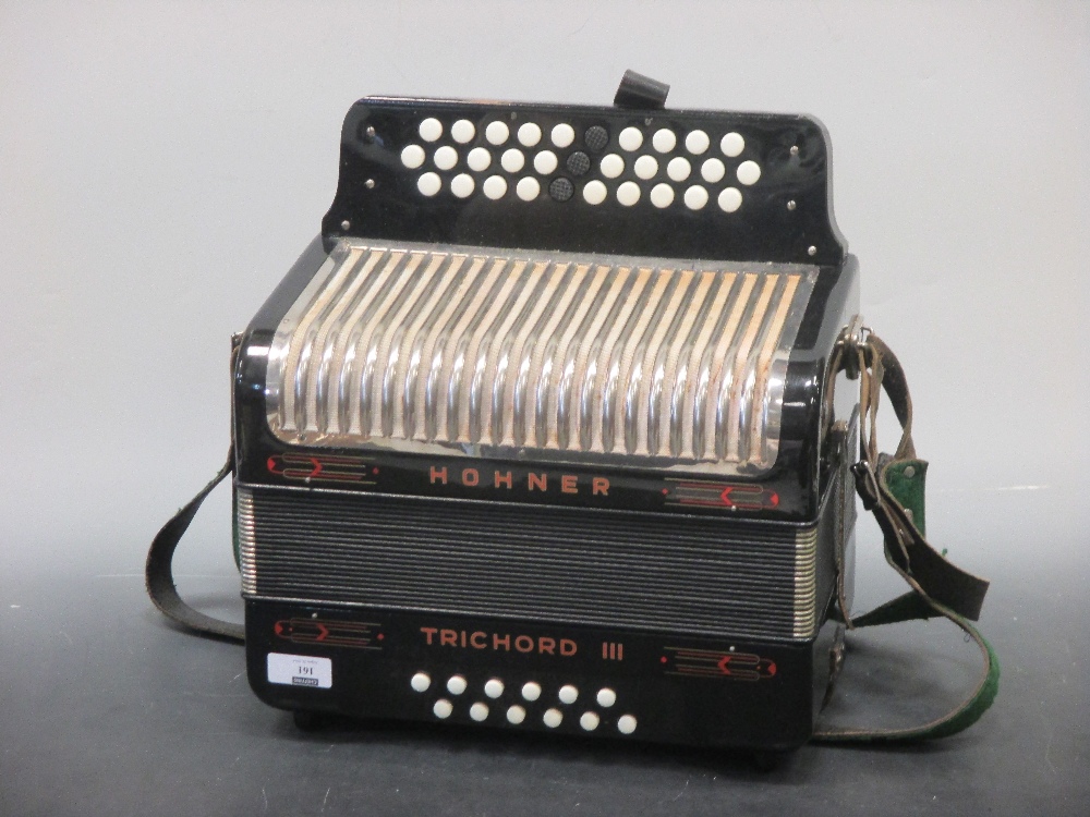 A Hohner Trichord III accordion, cased