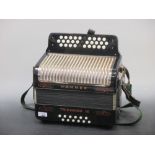 A Hohner Trichord III accordion, cased