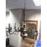 An Eastern six branch brass chandelier