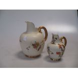 Two Royal Worcester floral ewers