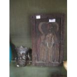 A carved oak head of a king and a carved panel in the antique style (2)