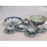 A group of twelve items of oriental blue and white porcelain, comprising five Chinese tea bowls,