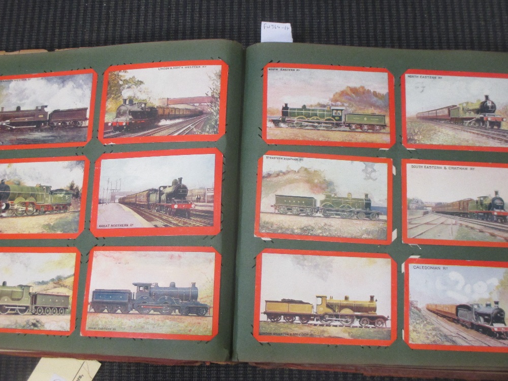 An album of early 20th century train related postcards, including a locomotive accident, mostly