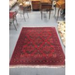 A large red Bilicik rug, 190 x 154cm
